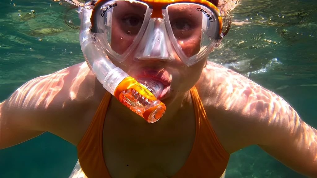 A snorkeler in the clear water at Mangel Halto on Aruba's south coast