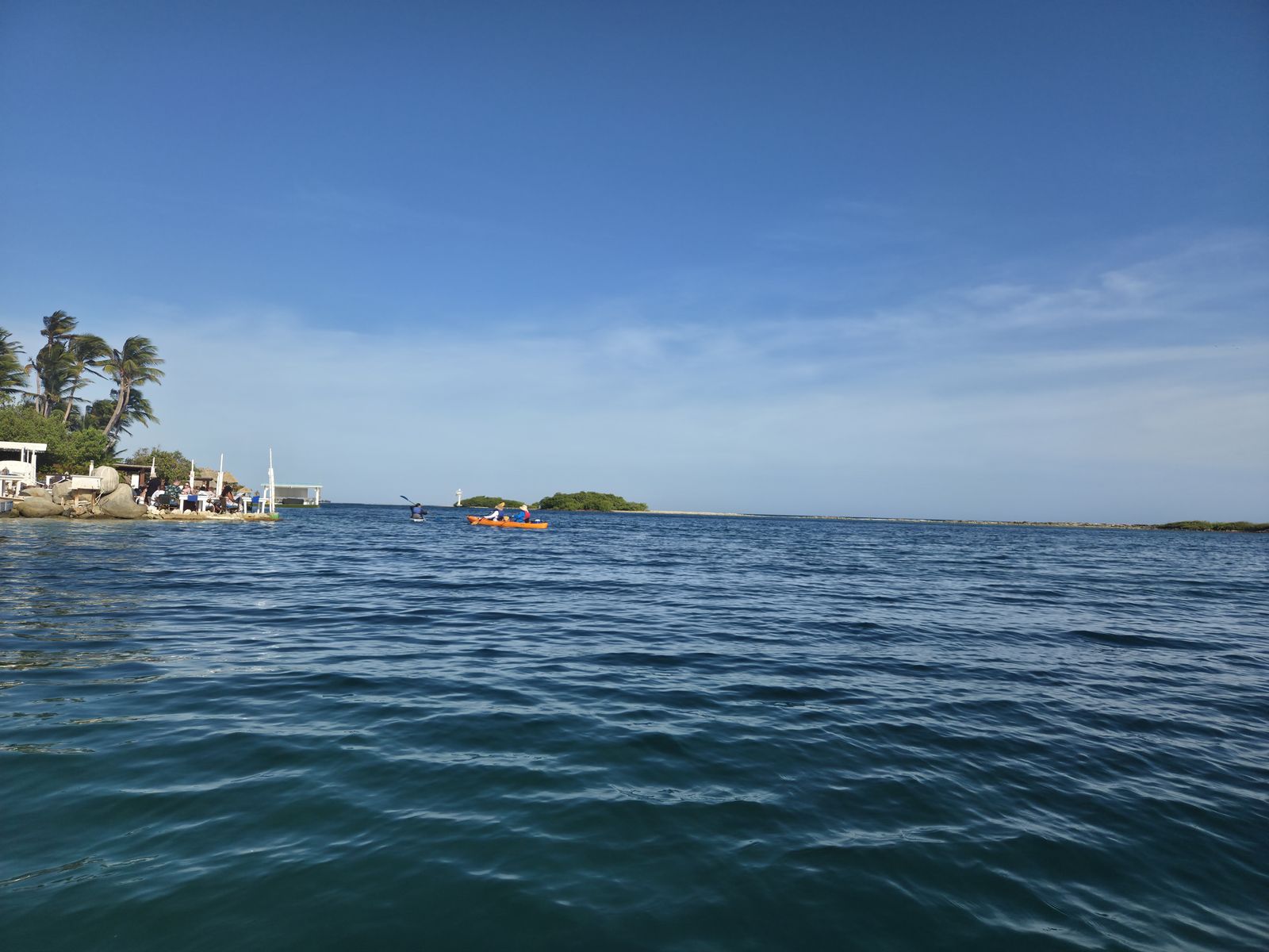 The Savaneta shoreline and its calm turquoise water, seen from a kayak